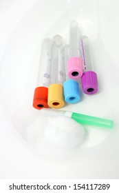 Unlabelled Pathology Phlebotomy, Blood Collecting Vacutainer Tubes A 21 Gauge Needle And Cotton Wool Lying In A Kidney Dish For A Blood Collection Procedure