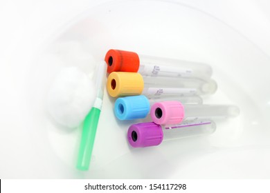 Unlabelled Pathology Phlebotomy, Blood Collecting Vacutainer Tubes A 21 Gauge Needle And Cotton Wool Lying In A Kidney Dish For A Blood Collection Procedure