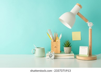 Unleash the spirit of fun learning with a side-view photograph displaying a variety of school supplies in organizer, notepads and desk lamp on a teal isolated background, perfect for text or advert