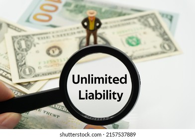 Unlimited Liability.Magnifying Glass Showing The Words.Background Of Banknotes And Coins.basic Concepts Of Finance.Business Theme.Financial Terms.