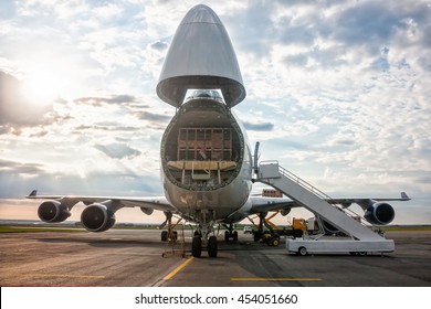 Unloading wide-body cargo airplane - Shutterstock ID 454051660