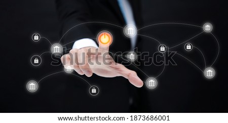 Unlocking the business investment concept, businessman touching Start icon for unlinking bank finance and keys with graph Screen Icon of a media screen, Technology Process System Business, 
