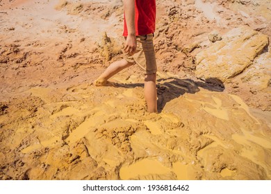 Unlucky Buried Person Standing In Natural Quicksand River, Clay Sediments, Sinking, Drowning Quick Sand, Stuck In The Soil, Trapped And Stuck Concept