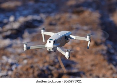 An unmanned aerial vehicle. The drone is in the air. The quadcopter is in flight.