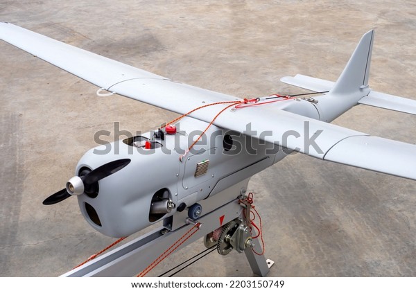 Unmanned aerial vehicle. Drone on platform to\
launch. Catapult to launch drone. Aircraft with remote control. UAV\
on platform to launch. UAV technology. Concept sale of unmanned\
aerial vehicles