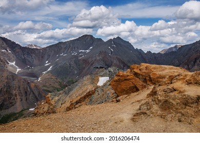 Unmanned Aerial Vehicle With A Radio-controlled Camera Or UAV (unmanned Aerial Vehicle) In The Mountains Of The Altai Republic. Top View Of The Snowy Peaks.