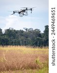 Unmanned aerial vehicle (UAV), commonly known as a drone, for agricultural fertilizer and pesticide spraying