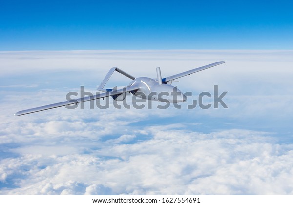 Unmanned aerial vehicles spy in the
sky flying over dense clouds over the territory of
patrol