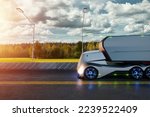 Unmanned autonomous cargo transportation. An autonomous, electric, self-driving truck with a trailer moves along the road. Fast cargo delivery, transportation without drivers