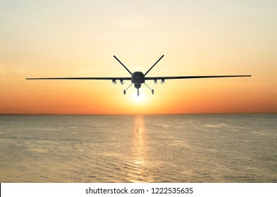 Unmanned Military Drone Patrols The Territory At Sunset, Flying Above Water Surface. The View Is Straight Ahead