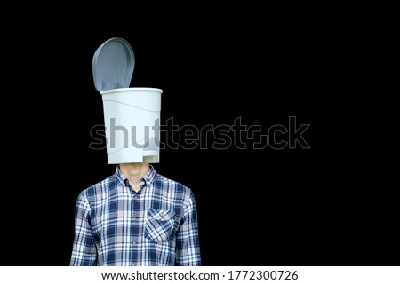 Unnecessary useless knowledge, information pollution concept. Man with trash bin for a head on black background. Contemporary modern art collage. 