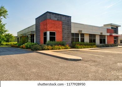 Unoccupied generic store front, business or professional office space. Sunny summer day. - Shutterstock ID 1177928950