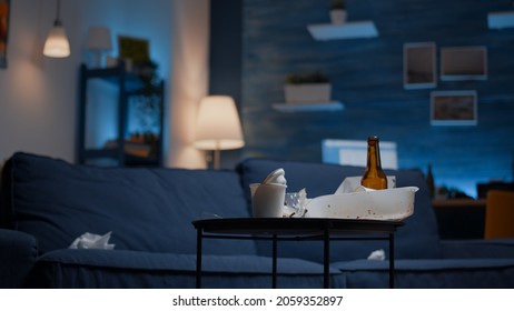 Unorganized House Apartment Of Alone Woman With Sever Depresion Having Trash, Rubbish With No People In. Messy Empty Living Room Of Depressed Person With Scattered Food Mess, Disorder Table