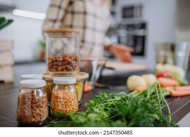 Unpacked local food in zero waste packaging on kitchen counter at home. - Powered by Shutterstock