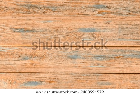  It is unpainted board. It is unpainted aged wooden fence. It is unpainted  wood background. It is sunny day.