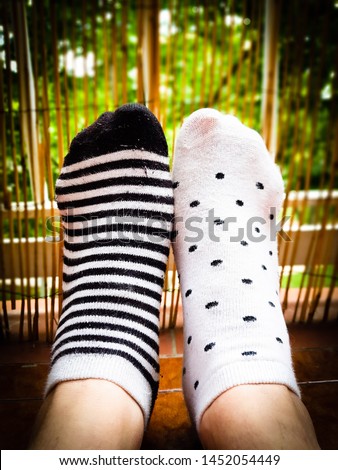 Unpaired socks, striped and polka dots.
