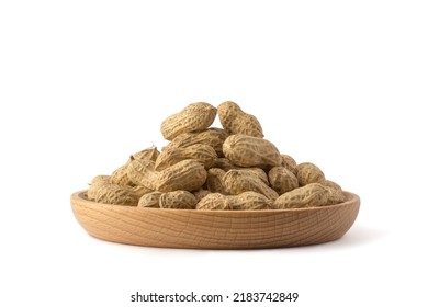 unpeeled peanuts in a tray, also known as groundnut, goober, pindar or monkey nut, isolated on white background