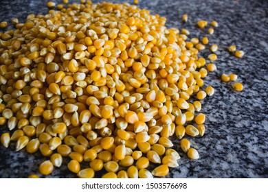 Unpopped popcorn. A type of corn that expands from the kernel and puffs up when heated.
