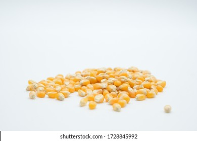 Unpopped Popcorns shot on a white isolated background.