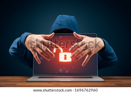 Unprotected computer usurped by hacker. Cyber security threat concept. Notebook with red screen and open padlock symbolizing unprotected computer.