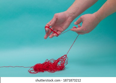 Unravel The Tangle Of Threads And Wind Them Around Your Hand.