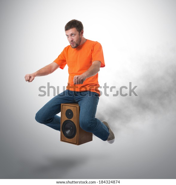 Unreal\
flying man on wooden speaker, motor sound\
concept