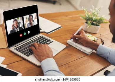 Unrecognizable African American Man Watching Business Webinar At Laptop And Writing Notes In Modern Office, Collage