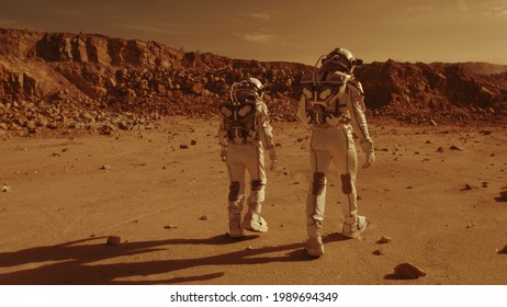 Unrecognizable astronauts walking on Mars
