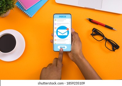 Unrecognizable black woman pressing READ buton on cellphone with email service app on screen, collage. African American lady having new messages in inbox. Electronic mail concept