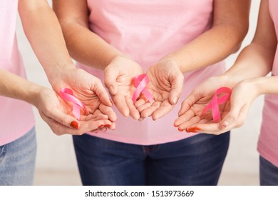 Unrecognizable Breast Cancer Volunteers Women Holding Pink Ribbons Standing Over White Background. Selective Focus, Cropped - Shutterstock ID 1513973669