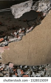 Unrecognizable Builder Using A Sledgehammer Breaking And Smashing The Wall Fallen Into Debris - Breaking Wall And Challenges Concept