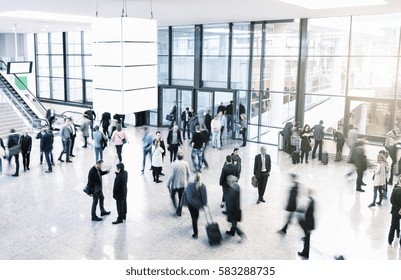 Unrecognizable Business People Rushing In A Modern Trade Fair Hall