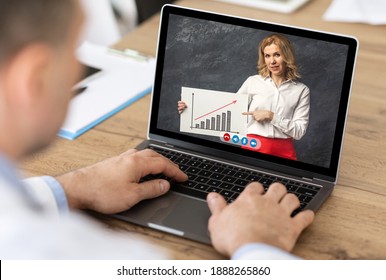 Unrecognizable Businessman Having Online Meeting With Colleague Video Calling Via Laptop Sitting In Modern Office. Closeup Of Computer Screen With Video Call. Remote Communication Concept. Cropped - Shutterstock ID 1888265860