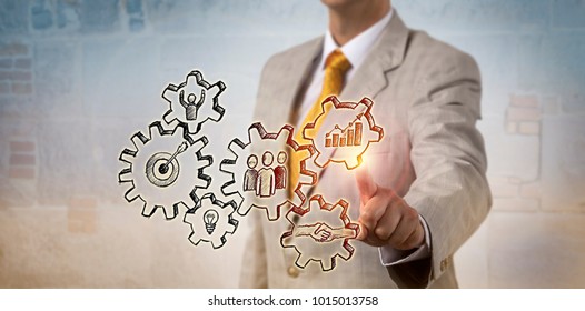 Unrecognizable Businessman Is Touching A Hand Drawn Gear Train Forming A Model For Successful Operations. Concept For Project Management, Corporate Strategy, Business Success, Team Work And Progress.