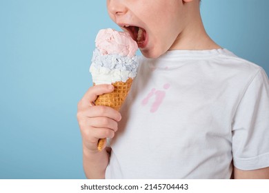 Unrecognizable child eating ice cream. dirty stain of strawberry ice cream on white clothes. daily life stain and cleaning concept . High quality photo - Shutterstock ID 2145704443