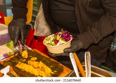 Unrecognizable Cook Holding A Salad With Tamale, Selective Focus.