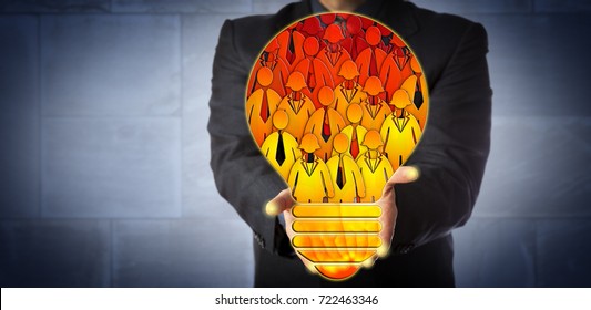 Unrecognizable Corporate Manager Offering A Virtual Talent Pool Shaped Like A Light Bulb Filled With Employee Icons. HR Concept For Team Building, Teamwork, Staffing Solution And Skilled Workforce.