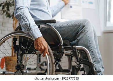 Unrecognizable disabled man sitting in a wheelchair