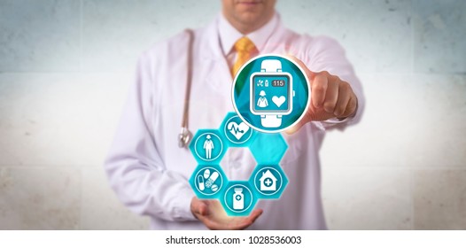 Unrecognizable Doctor Of Medicine Is Recommending A Smart Watch With A Pulse Trace App. Healthcare Electronics Concept For Wearable Technology, Internet Of Medical Things, IoT, IoMT And Connectivity.