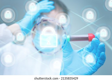 Unrecognizable Doctor Of Medicine Securing Patient Medical Records Across Multiple Devices Via A Computer Network. Healthcare IT Concept For Security Of Health Information Exchange And Data Privacy.