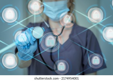 Unrecognizable Doctor Of Medicine Securing Patient Medical Records Across Multiple Devices Via A Computer Network. Healthcare IT Concept For Security Of Health Information Exchange And Data Privacy.