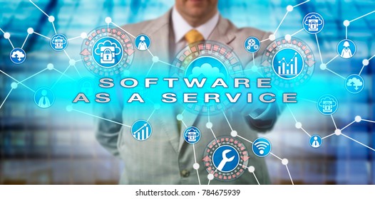 Unrecognizable enterprise manager operating a SOFTWARE AS A SERVICE application via computer network. IT concept for SaaS, multitenant architecture, horizontal scaling, scalability and multitenancy.