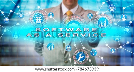 Unrecognizable enterprise manager operating a SOFTWARE AS A SERVICE application via computer network. IT concept for SaaS, multitenant architecture, horizontal scaling, scalability and multitenancy.
