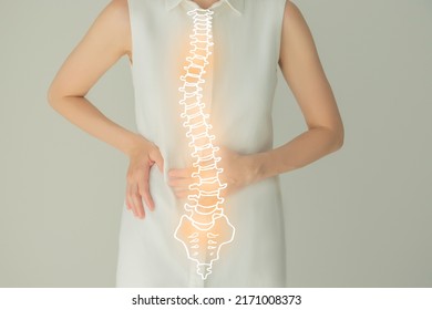 Unrecognizable female patient in white clothes, highlighted handrawn spine. Human spine structure issues concept. - Powered by Shutterstock