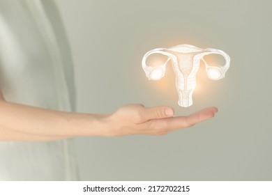 Unrecognizable female patient in white clothes, highlighted handrawn uterus in hands. Human reproductive system issues concept. - Shutterstock ID 2172702215