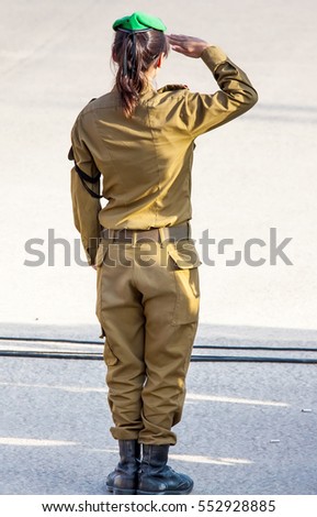 unrecognizable female soldier saluting