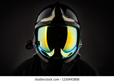 Unrecognizable Firefighter In Modern Helmet On Black Background 