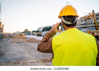 Unrecognizable Foreman Speaking On Smartphone