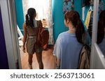 Unrecognizable Girls Walking In Their Dorm Room