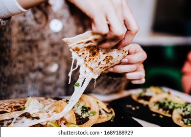 Unrecognizable Group Of Friends Eating Mexican Food In A Restaurant. Delicious Fajitas. Lifestyle Outdoors